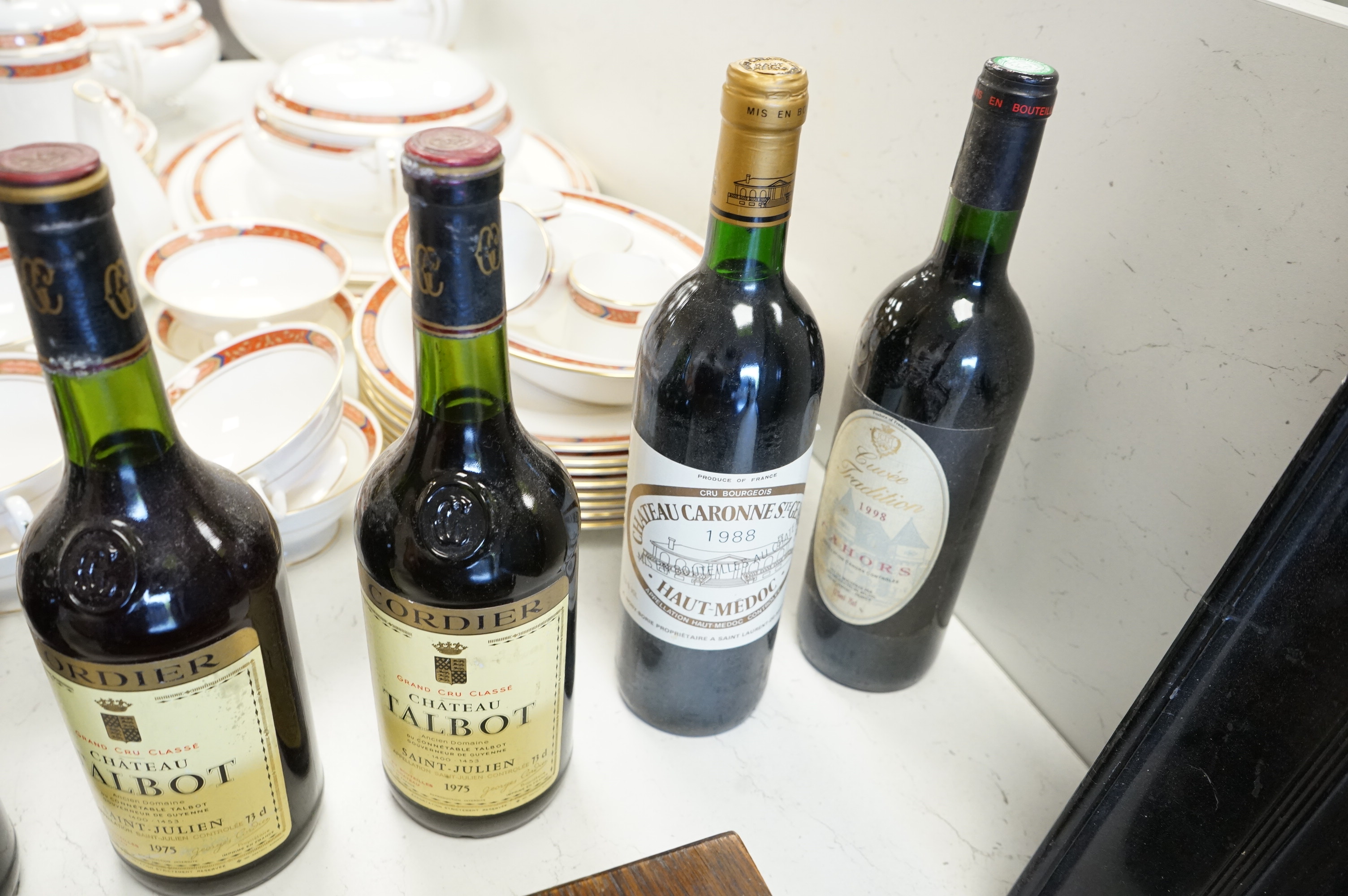 Eight bottles of red wine including three bottles of Chateau Talbot Saint Julien 1975, Chateauneuf du Pape 2008, Chateau Caronne Ste Gemme 1988 etc.